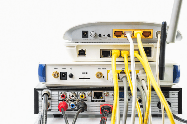 How does a router connect devices in a network?